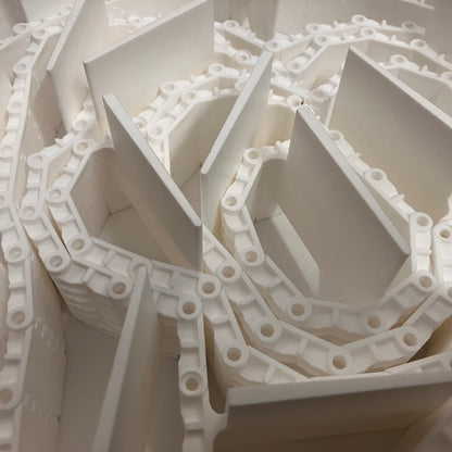 Inner flighted section of packaging conveyor belt for CURO